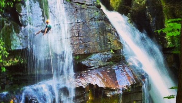 Person enjoying the Big Bradley Rappel and Waterfall Trek adventure